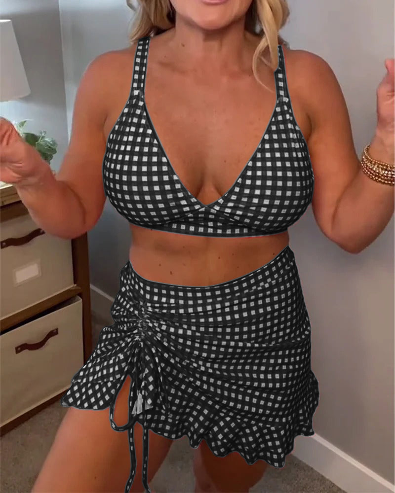 Baddräkt med avslappnat rutigt mönster och tvådelade axelband